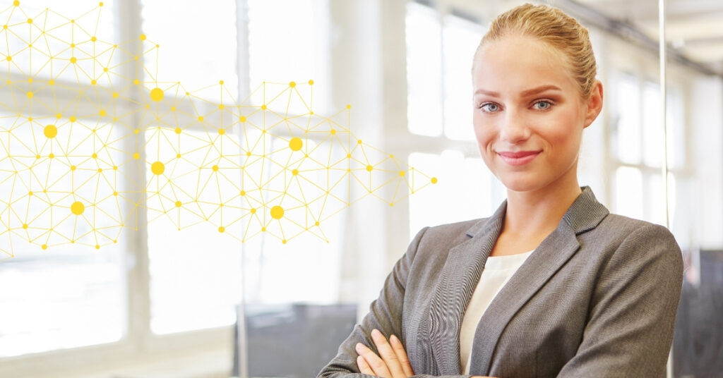 Confident AI consultant in a business suit standing in a modern office, with a network data visualization overlay, representing the expertise of AI consultants.