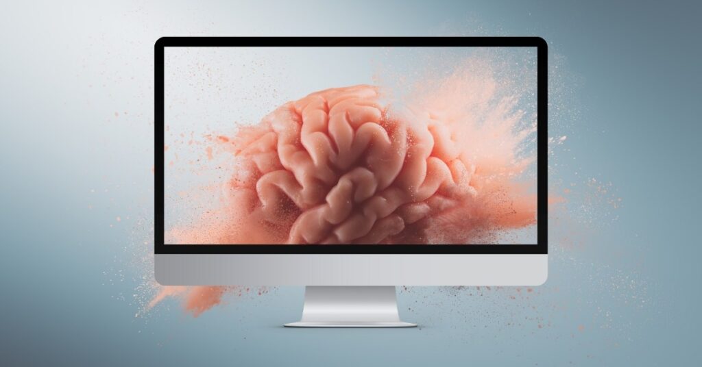 Digital brain emerging from a computer screen, symbolizing AI and creativity.