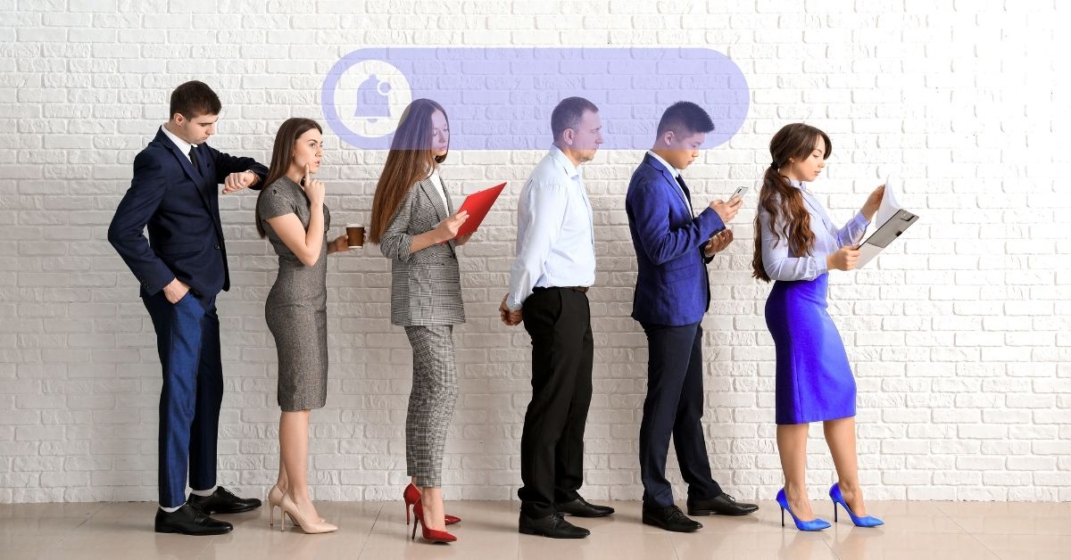 Business professionals standing in line, symbolizing strategies to attract new clients.