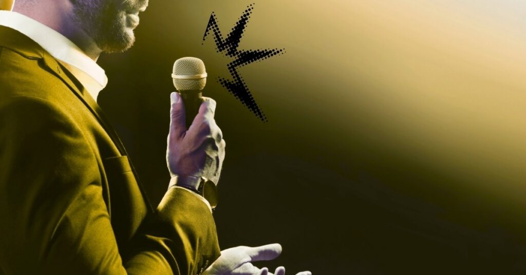 Public Presentation Tips – confident speaker holding a microphone on stage