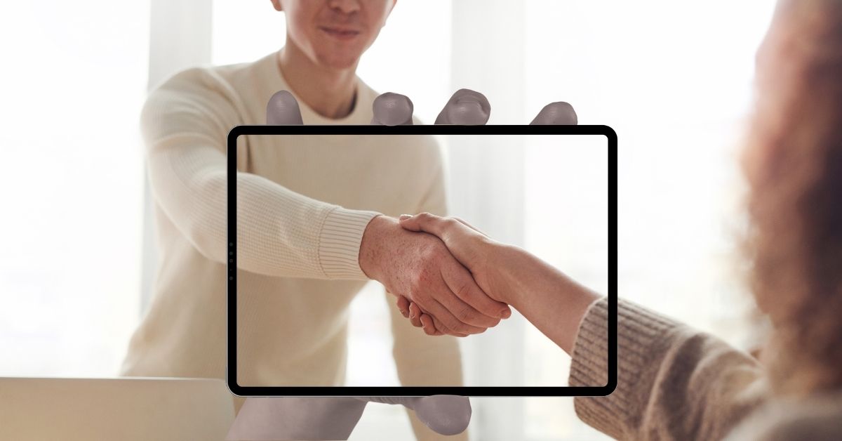 How to retain clients – two people shaking hands to build trust
